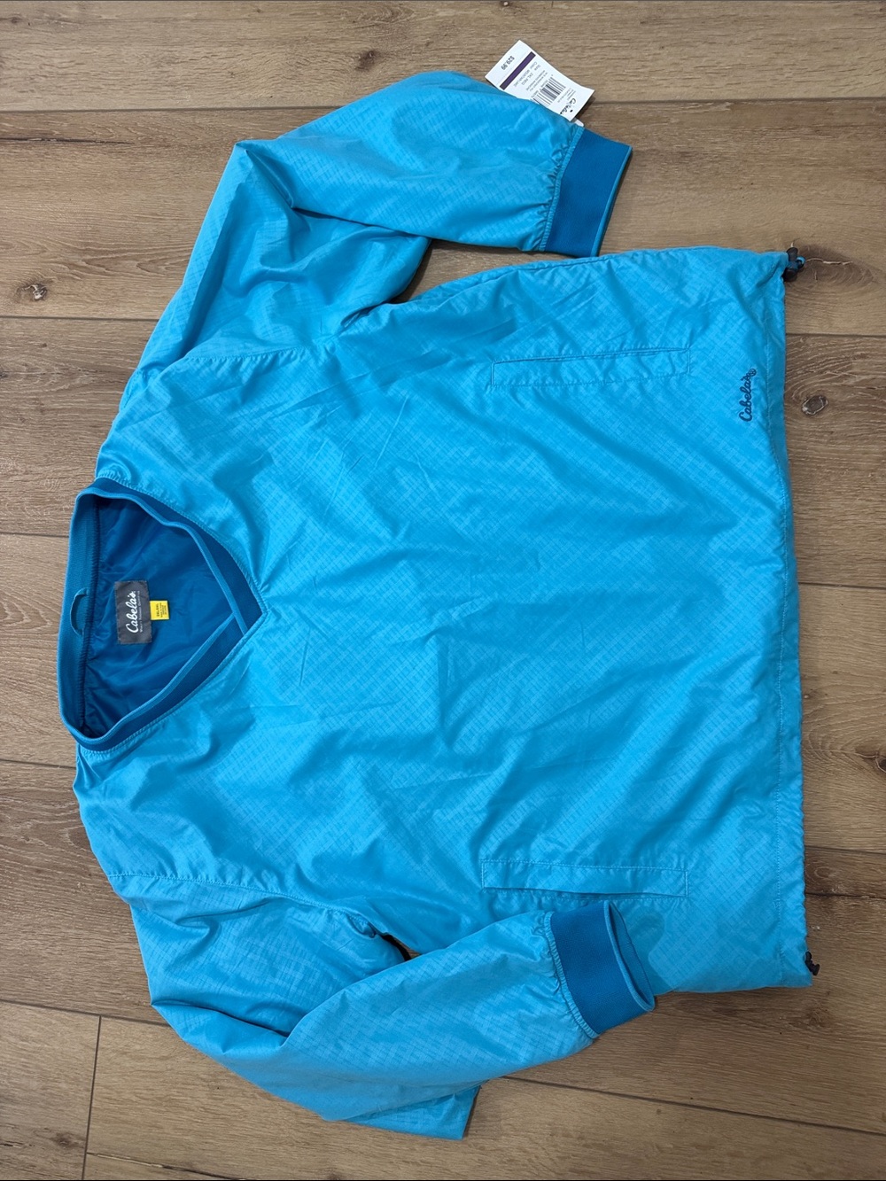 Columbia woman’s  Bright Turquoise Pullover Windbreaker